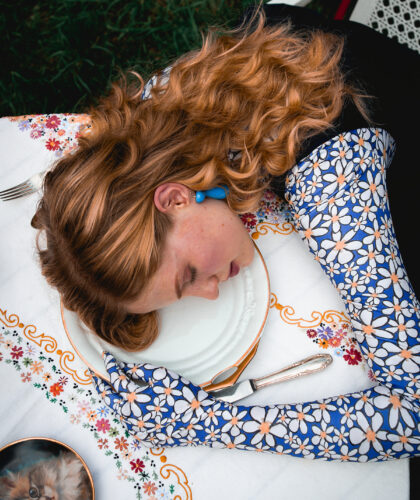 Model With Her Head Resting On A Table
