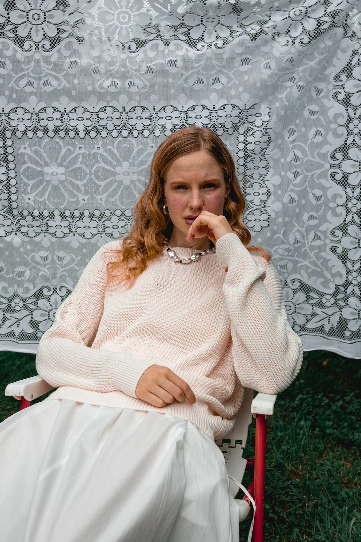 Model Sitting In A Chair