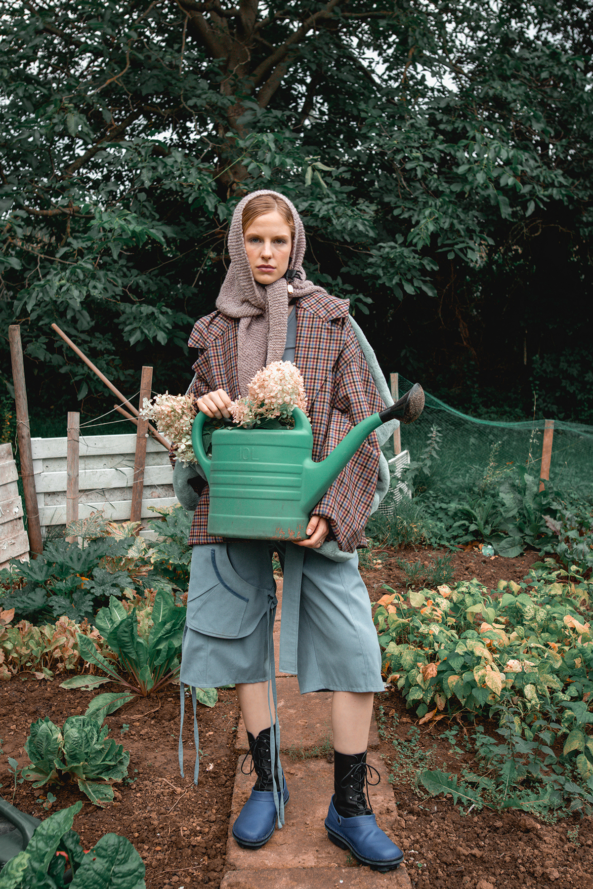 Model Posing With A Watering Can