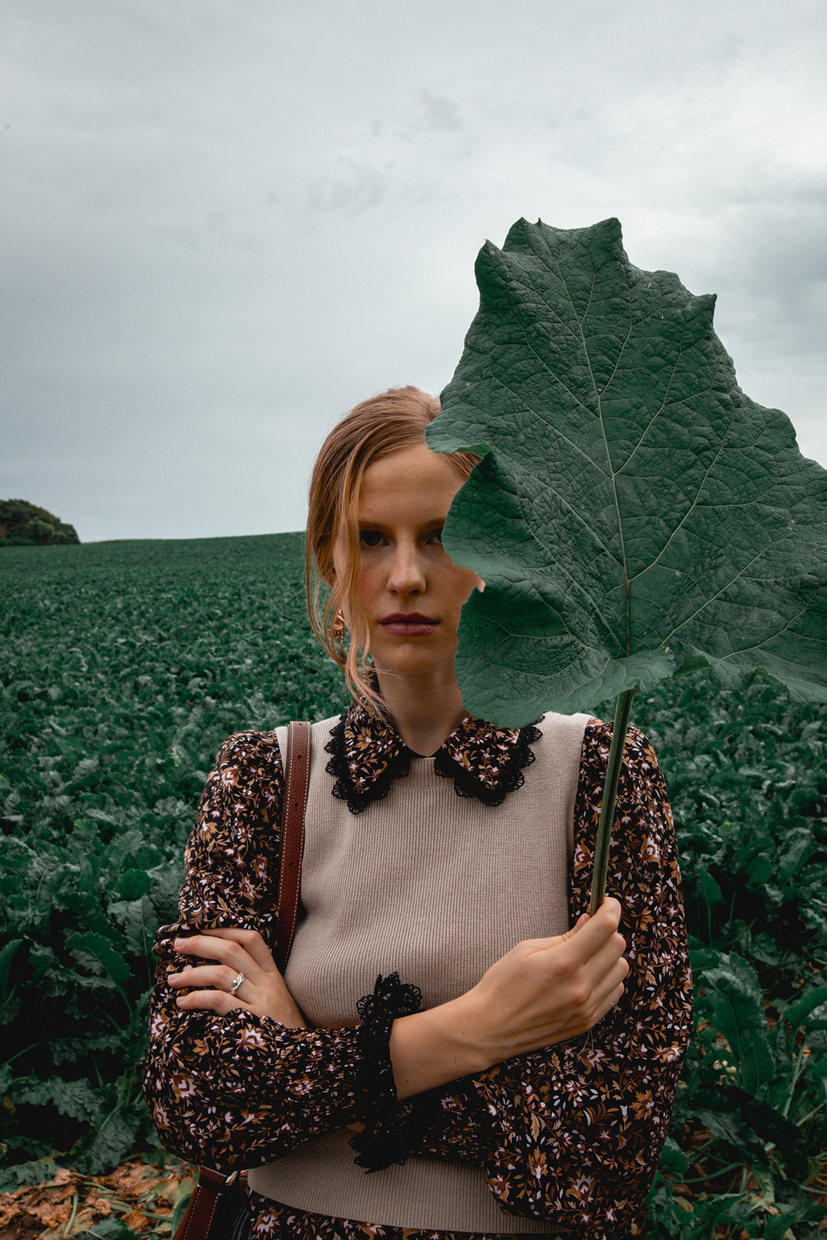 Model Posing Behind A Leaf
