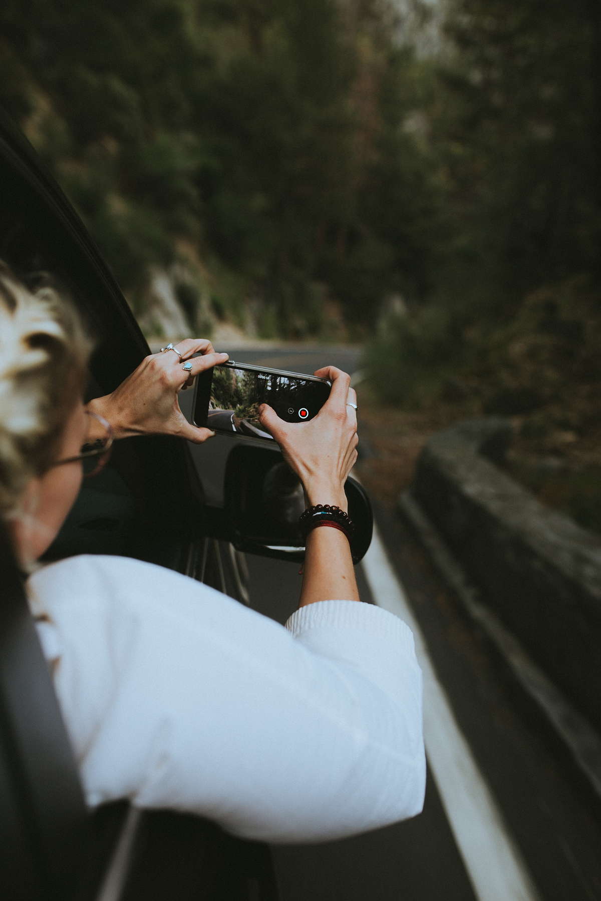 Person Taking A Photo In A Car