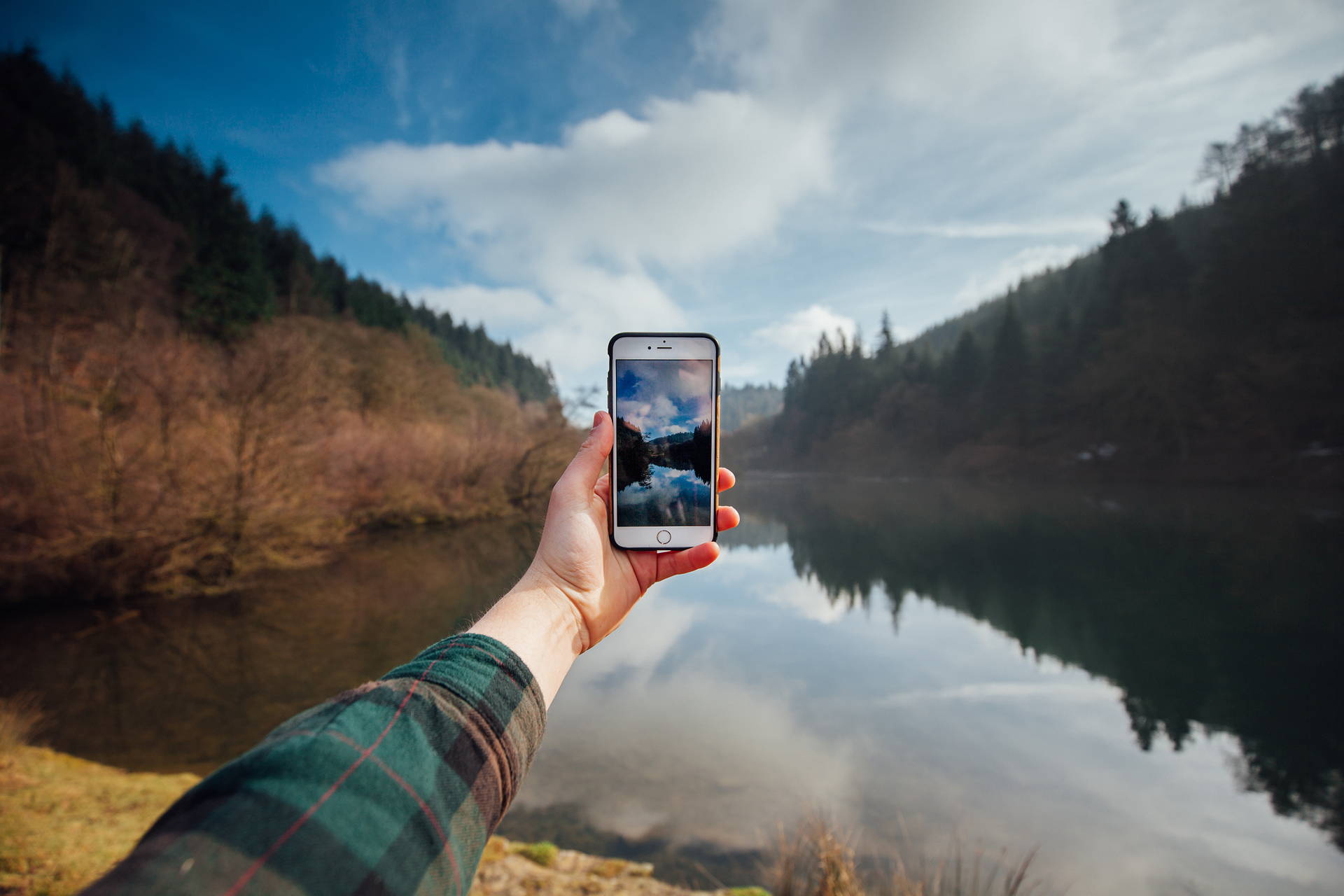 Phone Being Held With Lake Background Sustainable Apps