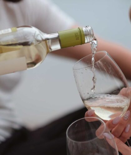 Wine Being Poured Into A Glass